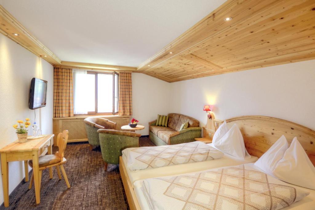 Hotel Restaurant Alpina Grindelwald Quarto foto